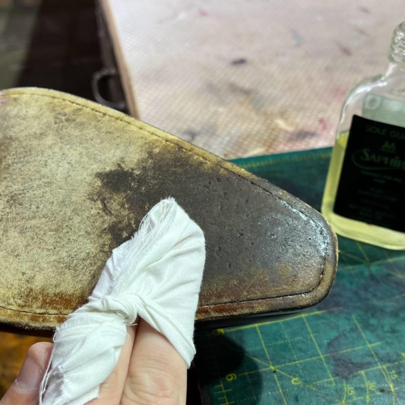 Saphir Médaille d'Or Sole Guard being applied to a leather sole — protecting the underside against abrasion and salt